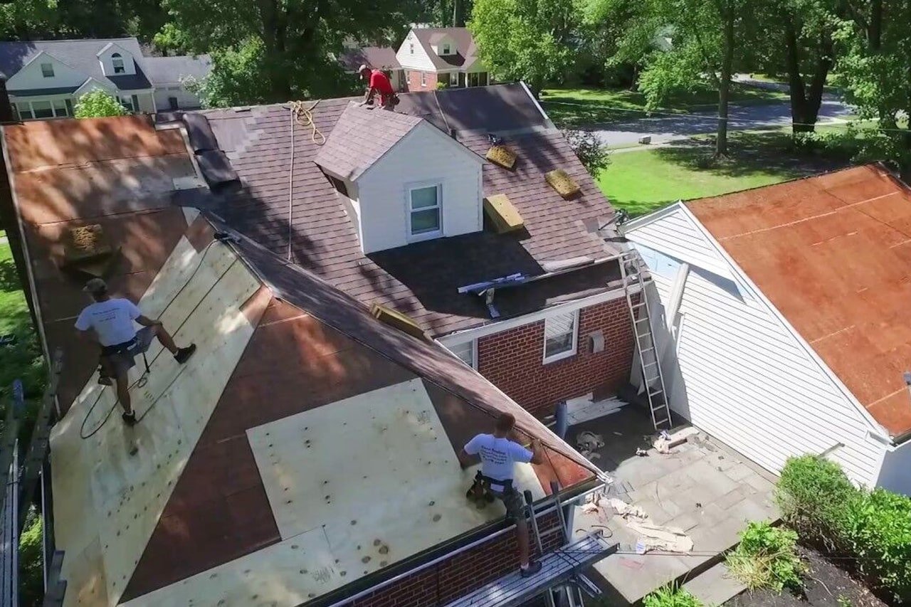 Haverford Pa red brick house with LandMark Pro Shingles being installed
