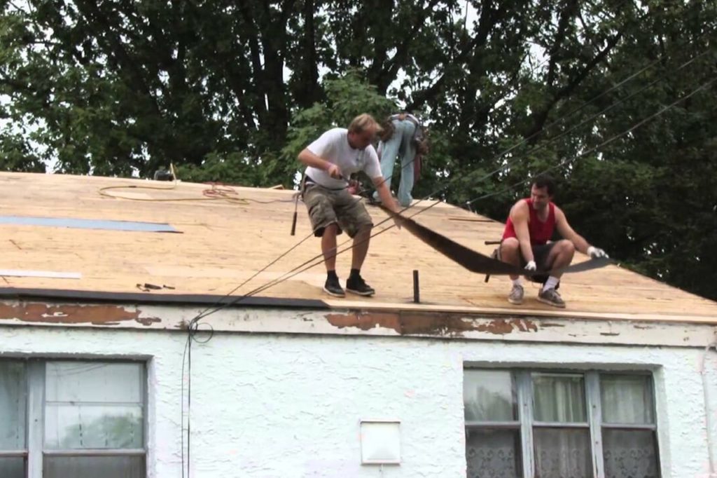 white house in Phoenixville Pa before new roof installed to repair storm damage