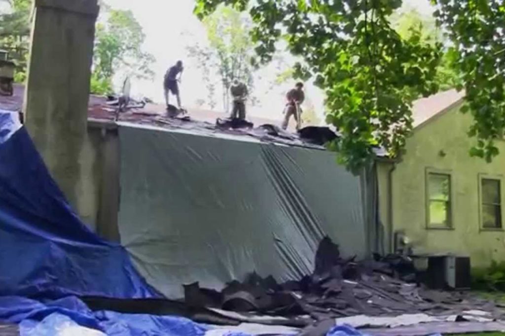 Shingles being removed from a Bryn Mawr Pa. home by Lower Merion Roof Company